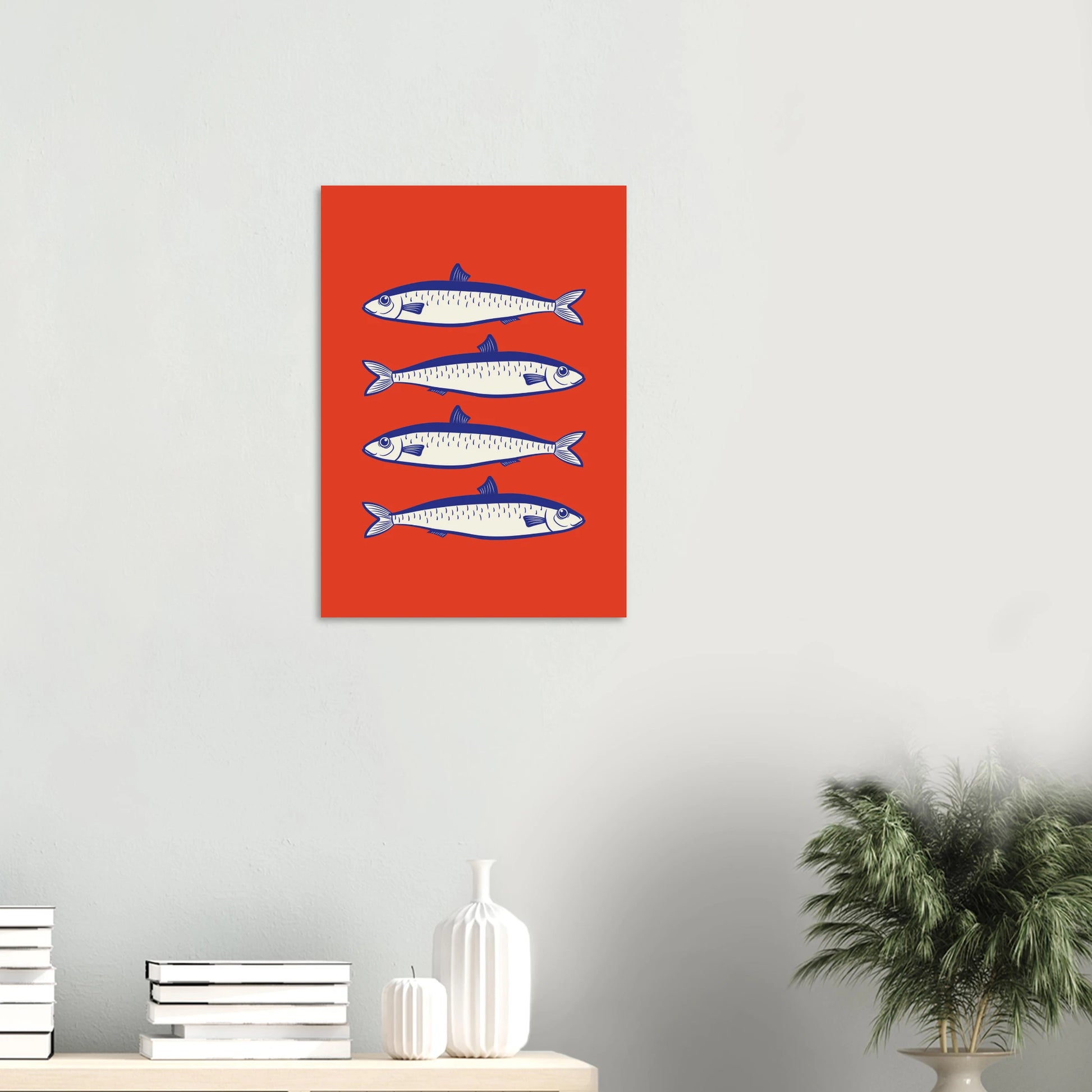 Aesthetic coastal art print featuring a vertical stack of four blue and white sardine fish illustrations over a bold, solid red background.