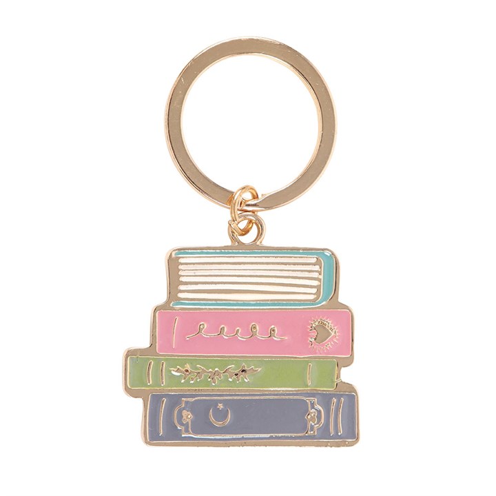 Close-up of a enamel keyring, showing a pastel stack of four books on a white background