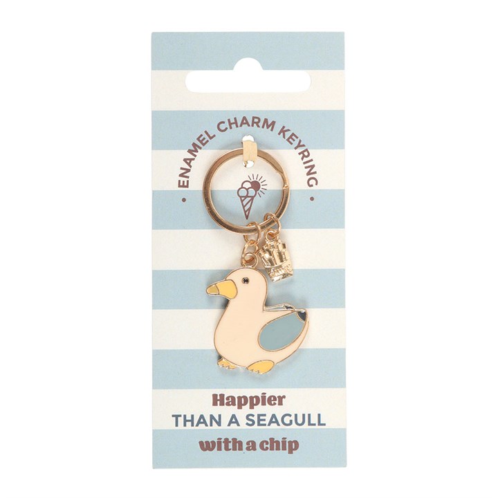 Enamel seagull keyring with a small gold chip charm on a white background