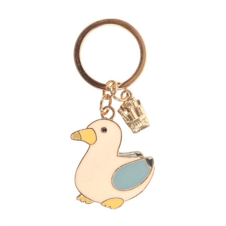 close up of Enamel seagull keyring with a small gold chip charm on white background