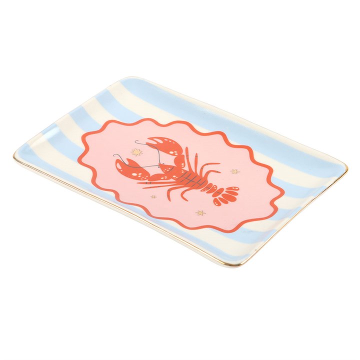 Side view of rectangular ceramic trinket dish with a red lobster and light blue and white vertical stripes on white background