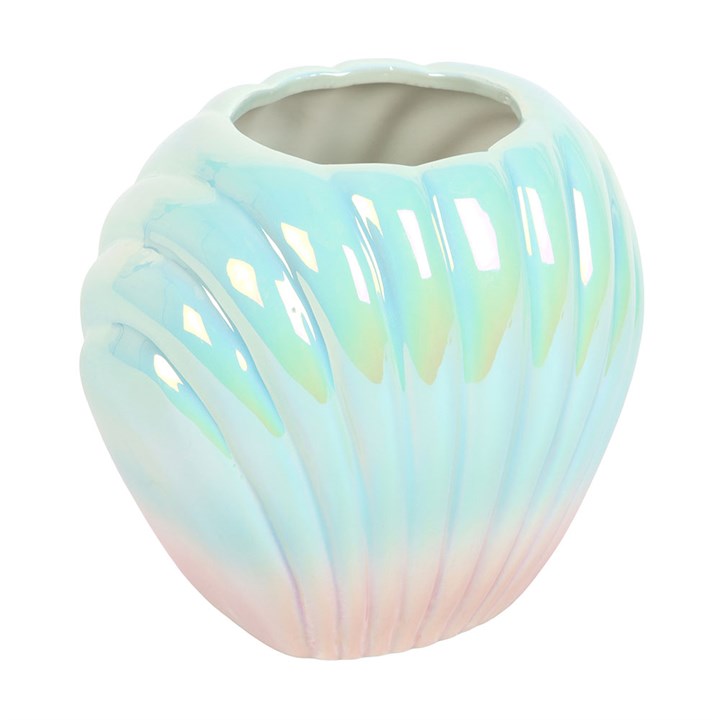 Pearlescent blue and pink ceramic shell vase on white background