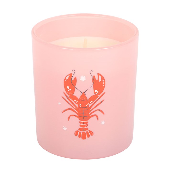 Pastel pink glass candle with red lobster illustration on white background