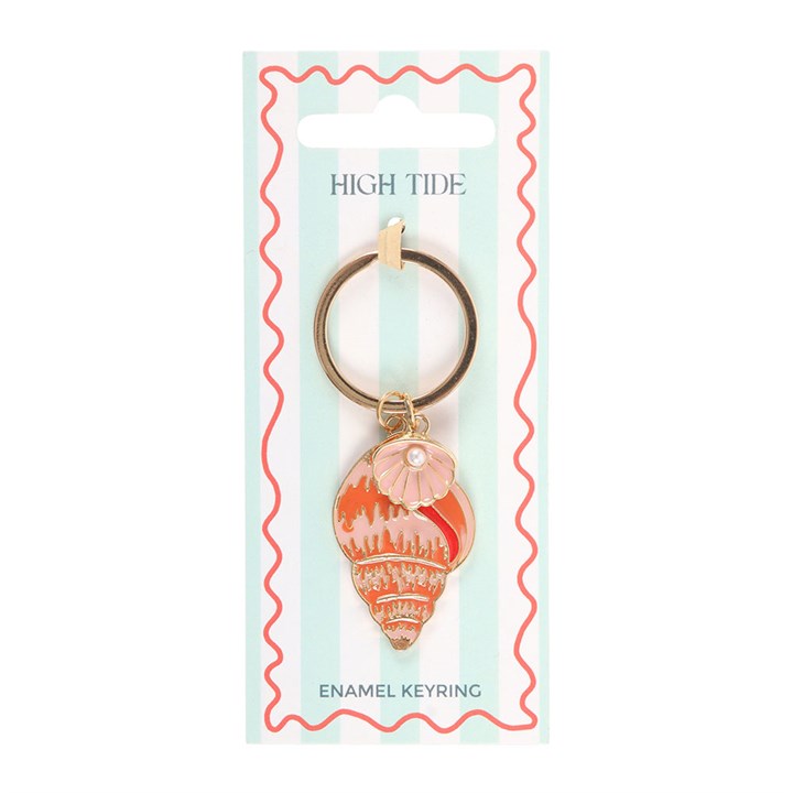 Peach and coral enamel conch shell keyring with a small oyster and pearl detail on a blue and white striped gift card on white background
