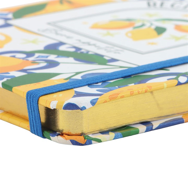 Detail of A5 recipe journal with a vibrant yellow lemon print cover and 120 lined pages and blue band