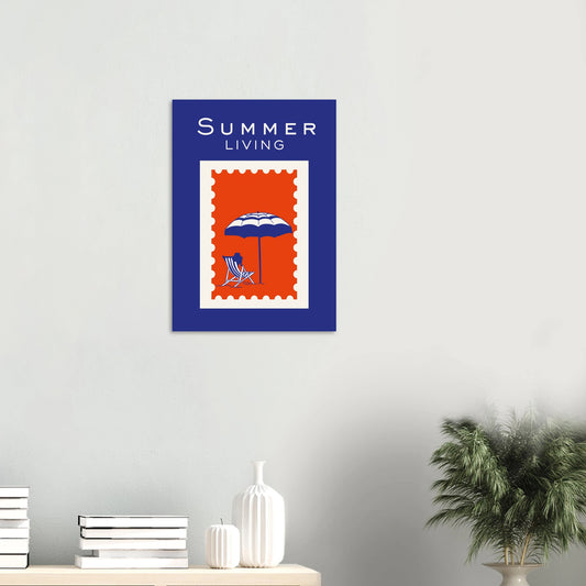 Retro postage stamp styled travel art print reading Summer Living featuring a blue and white striped deckchair and sun umbrella graphic over a red stamp with a cobalt blue background.